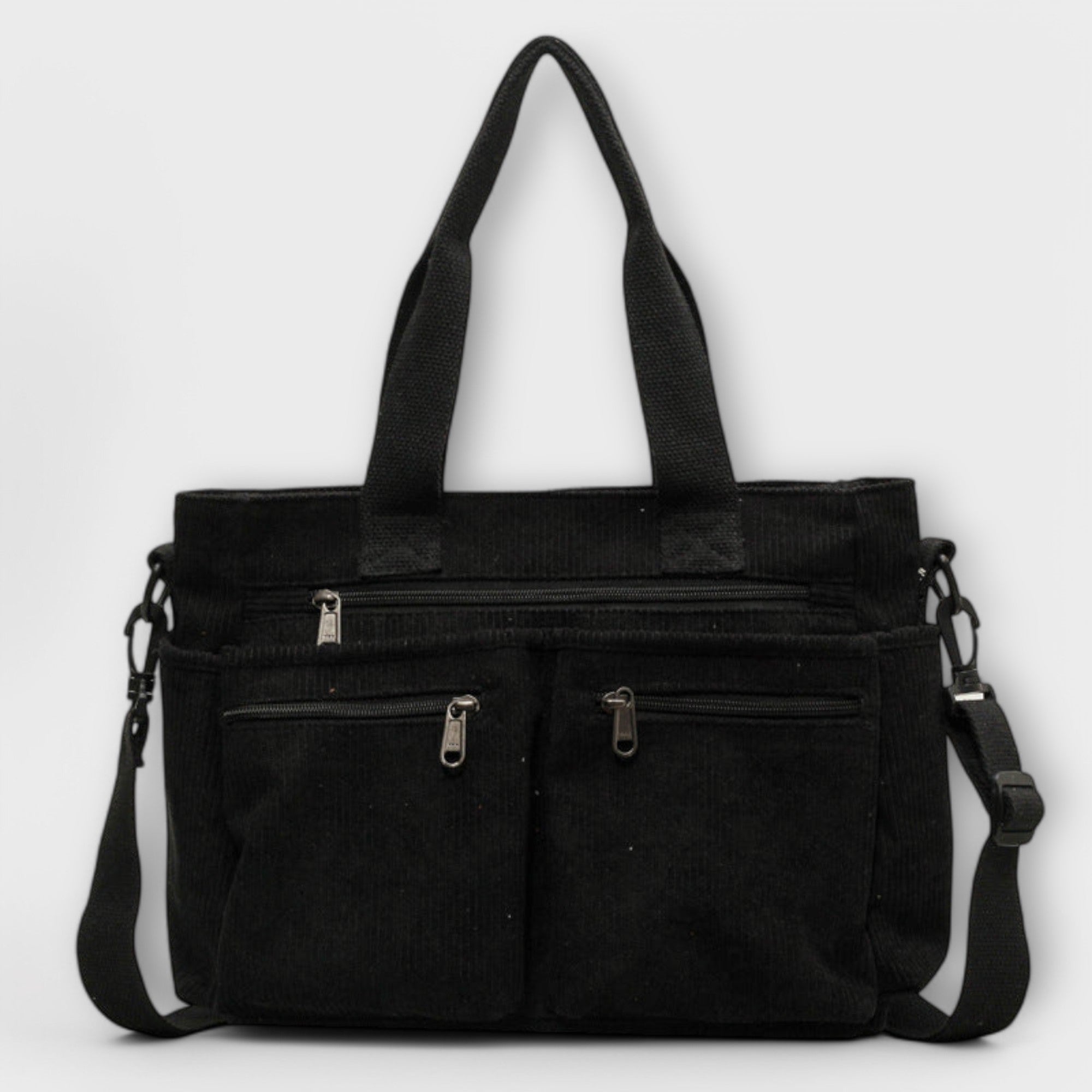 Sac cabas Aveline noir en toile, anses hautes et bandoulière, poches zippées.
