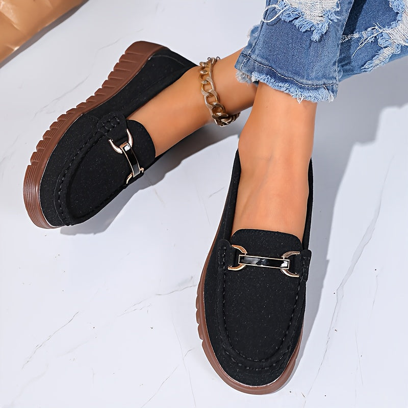 Mocassins noirs à boucle métallique et semelle brune
