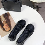 Ballerines noires souples avec dessus matelassé en losanges, bout arrondi