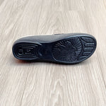 Dessous de mules fourrées d’intérieur noires avec motif en relief antidérapant