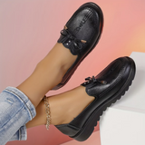 Mocassin noir à lacets avec nœud sur le dessus, vue latérale
