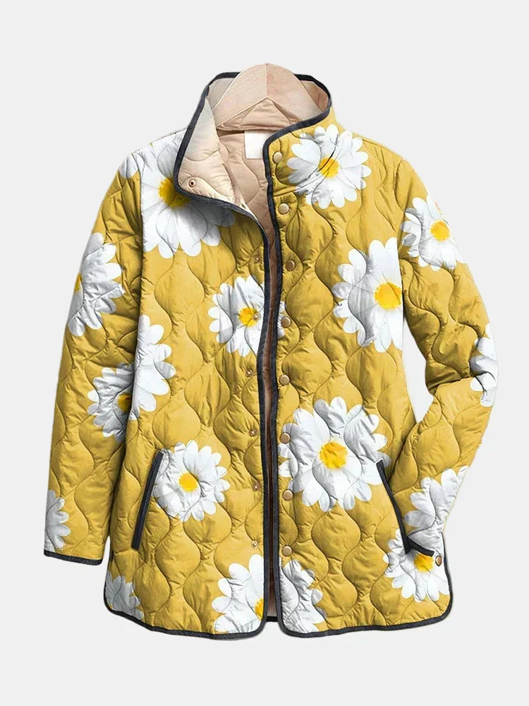 Veste matelassée jaune, motif marguerites blanches, fermeture zippée et col beige.