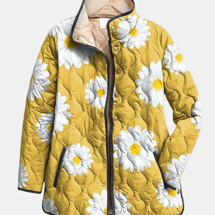 Veste matelassée jaune, motif marguerites blanches, fermeture zippée et col beige.
