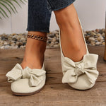 Ballerines à bout arrondi beige, nœud près de l’empeigne, semelle plate