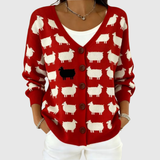 Cardigan en tricot rouge à boutons, motifs de moutons blancs
