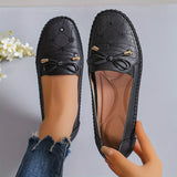 Mocassins Annabelle noirs à lacets, nœud avant et empiècements matelassés.