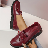 Mocassins bordeaux à lacets, dessus verni et semelle noire crantée