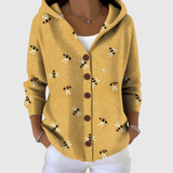 Cardigan en tricot à capuche moutarde, motif abeilles et boutons
