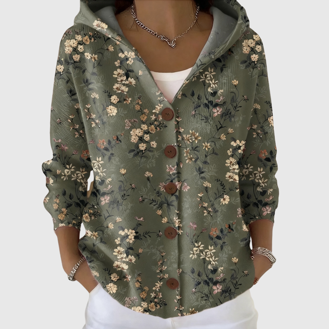 Cardigan Constance à capuche en tricot vert foncé à fleurs, boutons devant, manches longues.