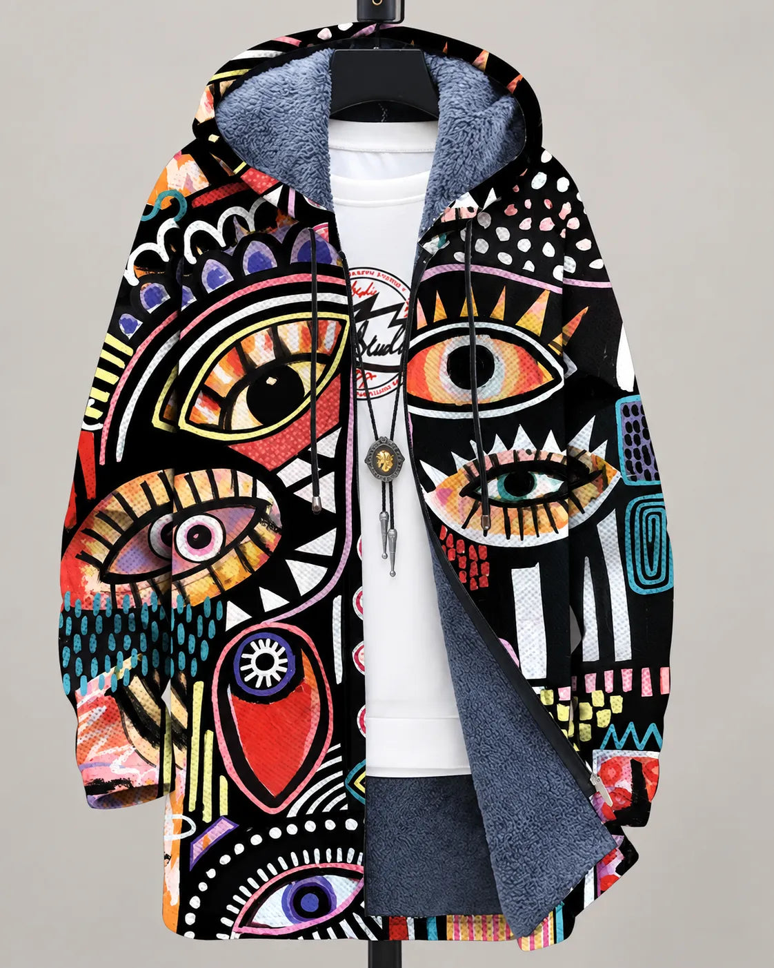Veste à capuche zippée imprimée multicolore, doublure sombre et cordon.
