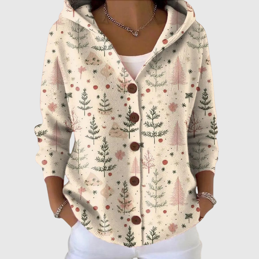Cardigan en tricot à capuche beige clair, motif sapins et étoiles, boutonné.
