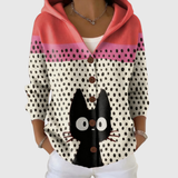 Cardigan en tricot à capuche rouge corail, beige à pois noirs, boutons bruns, chat.