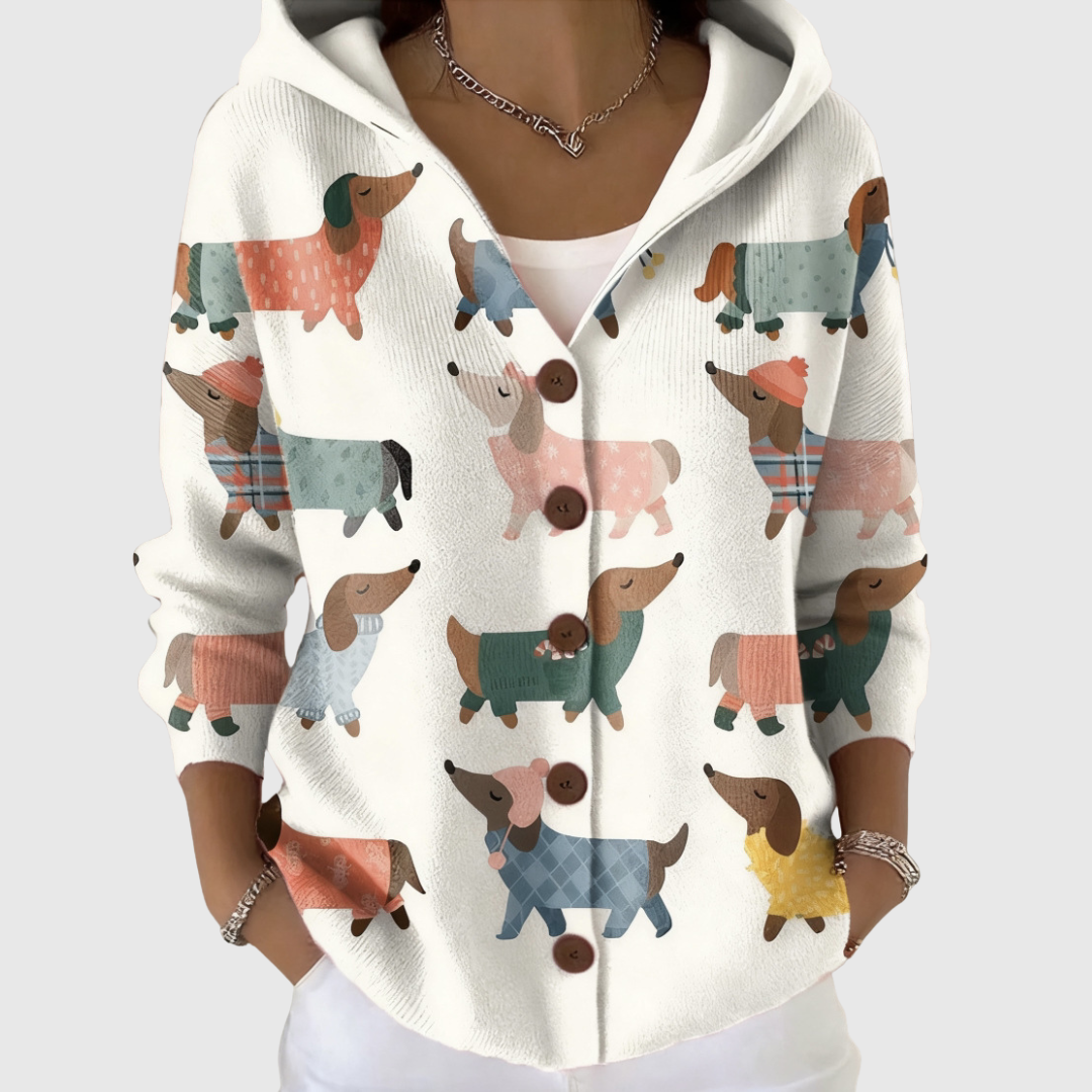 Cardigan en tricot à capuche blanc, boutonné, motif chiens colorés.