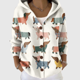 Cardigan en tricot à capuche blanc, boutonné, motif chiens colorés.