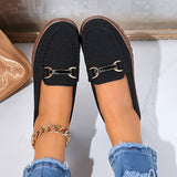 Mocassins noirs vue de dessus, boucles métal et surpiqûres visibles