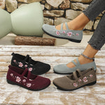 Chaussures plates bicolores: noir, bordeaux et beige, motif floral brodé.