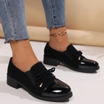 Mocassins Nadège noirs à talon bloc, semelle crantée et nœud sur le dessus.