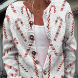 Cardigan festif blanc à motif canne de sucre rouge, boutons, manches longues.
