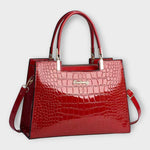 Sac à main en cuir effet crocodile brillant rouge, poignées rigides et bandoulière