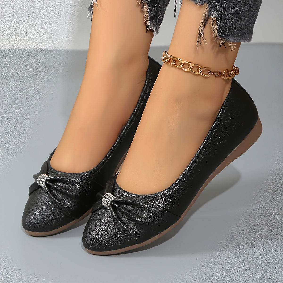 Ballerines noires à nœud froncé et strass, semelle marron clair