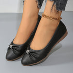 Ballerines noires à nœud froncé et strass, semelle marron clair