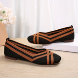 Ballerines souples à rayures, tissu noir et orange, bout pointu, semelle plate.