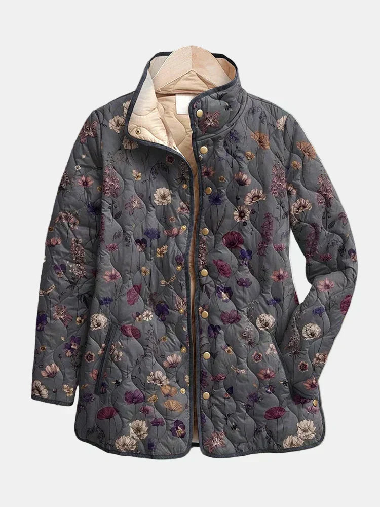 Veste matelassée imprimé floral multicolore, fermeture boutonnée, col montant, manches longues.