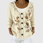Cardigan en tricot crème à encolure V, boutons noirs et motif floral ton sur ton