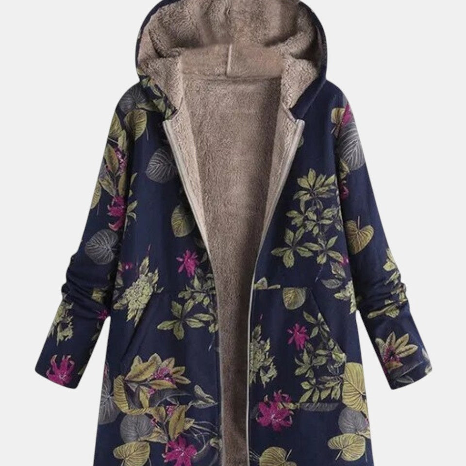Manteau bleu marine à capuche, doublure beige et motif floral sur l’avant