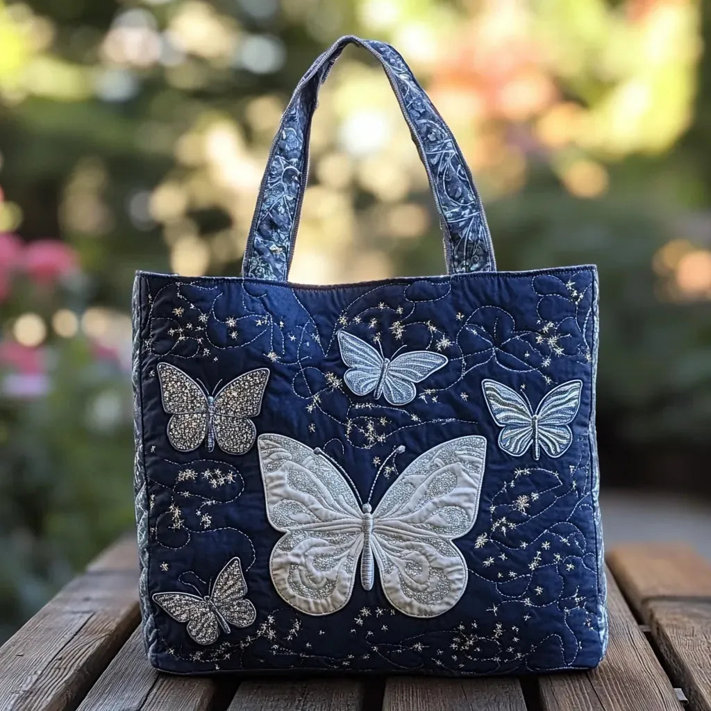 Grand cabas en tissu matelassé bleu nuit, broderies de papillons argentés, anses