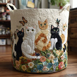 Panier à linge en tissu crème avec appliqués de chats brodés et anses.