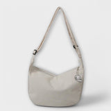 Sac à épaule en Cordura beige clair, bandoulière, forme demi-lune, petit pendentif nuage