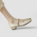Chaussures bébé dorées, bout arrondi, talon orné de strass et bride