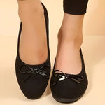 Ballerines noires en tissu avec nœud à l’avant