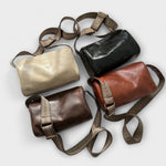 Sacs bandoulière vintage en cuir, plusieurs coloris : sable, noir et marron.