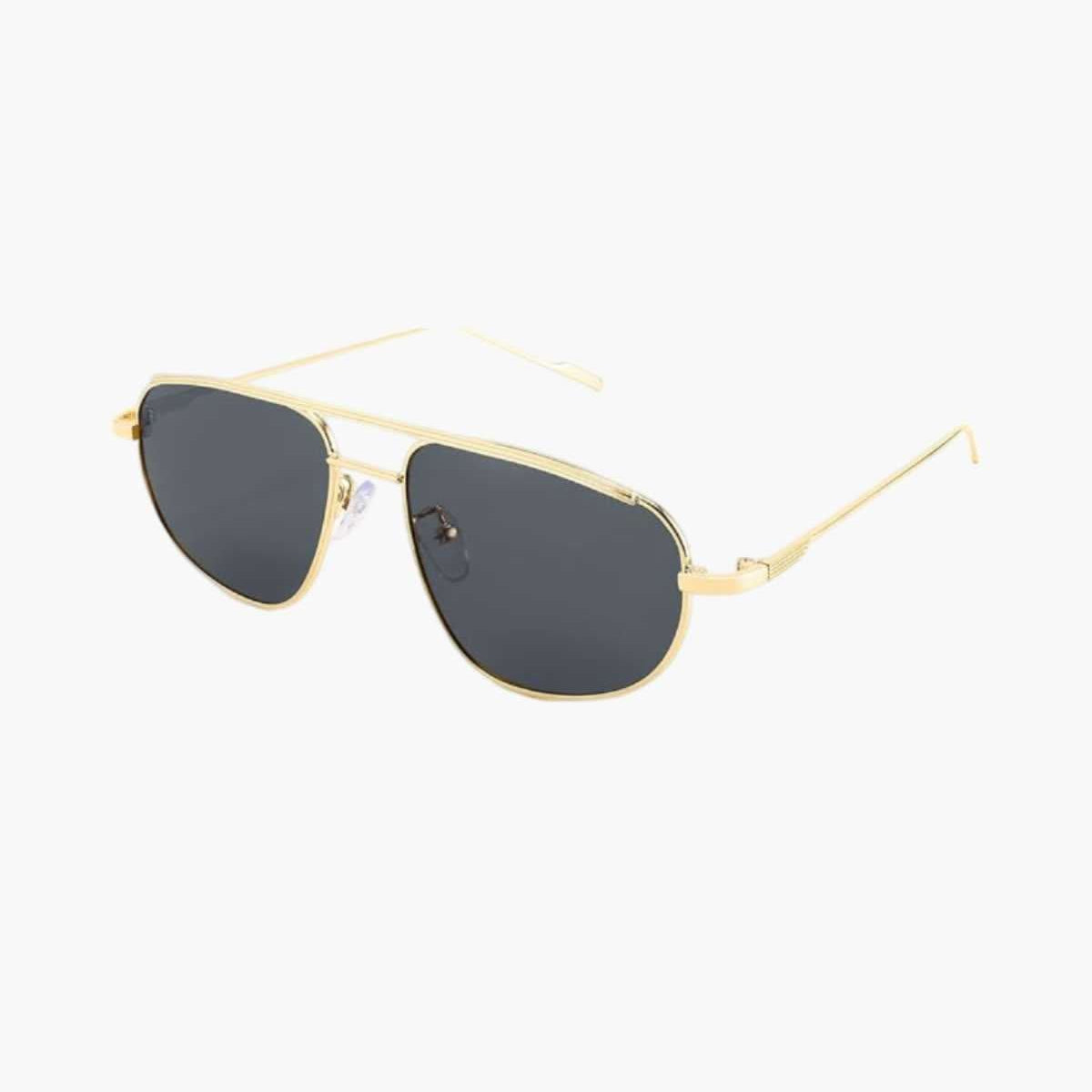 Lunettes de soleil à monture dorée et verres foncés, forme œil-de-chat