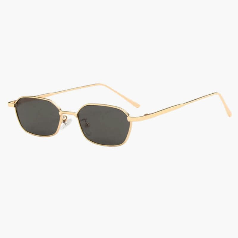 Lunettes de soleil à monture dorée et verres foncés, forme ovale