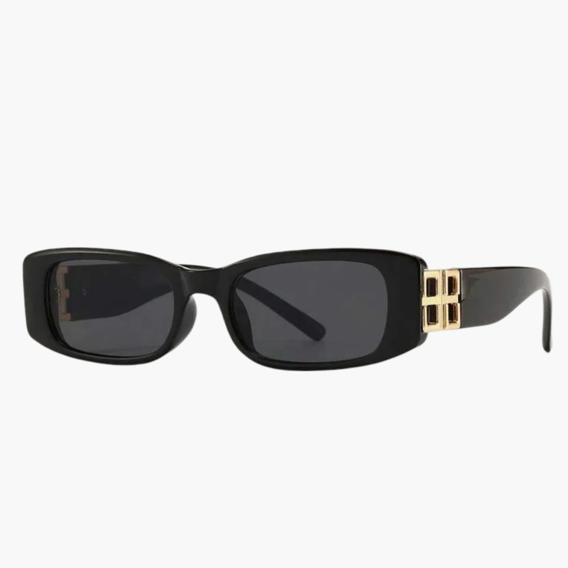 Lunettes de soleil contemporaines noires, verres foncés, détail boucle dorée sur la branche