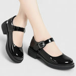 Chaussures bébé noires vernies à bride et boucle, semelle épaisse à profil