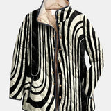 Veste matelassée boutonnée noir et blanc à motif géométrique, col simple, doublure beige