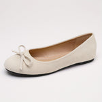 Ballerines souples beige clair, bout rond à nœud, semelle noire