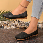 Mocassins noirs à bout arrondi, bride croisée et semelle crantée claire