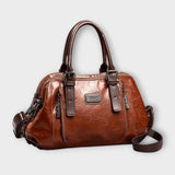 Sac à bandoulière vintage en cuir marron, anses rigides et bandoulière réglable