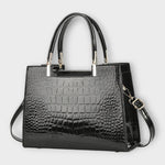 Sac à main en cuir effet crocodile brillant foncé, poignées rigides et bandoulière