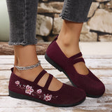 Chaussures plates bordeaux à brides et broderies florales roses sur le dessus
