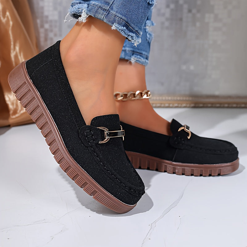 Mocassins noirs à boucle métal, dessus en textile et semelle crantée