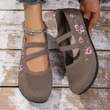 Chaussures plates marron foncé à brides et broderies florales roses