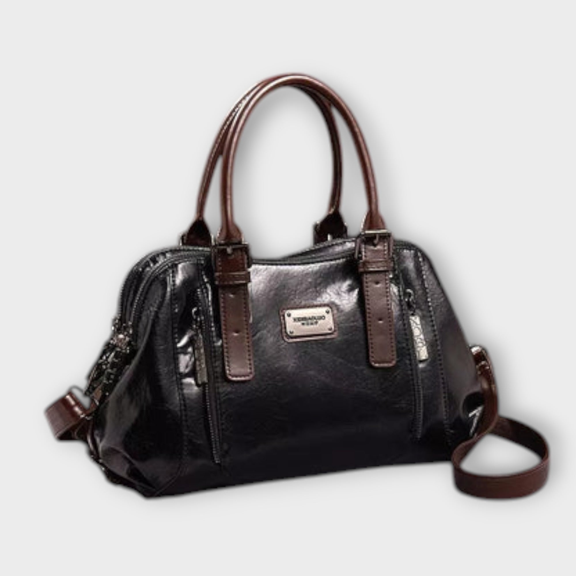 Sac à bandoulière vintage en cuir noir, anses rigides, poche zippée frontale