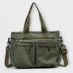 Sac cabas Aveline vert en toile, double poches zippées et bandoulière réglable.