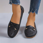 Mocassins Annabelle noirs à lacets, nœud avant et semelle crantée.